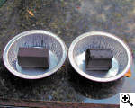 Side by side comparison of old and new Kamado extruded coconut charcoal